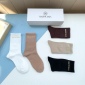 Replica Balenciaga's new gold bronzed midtube women's socks