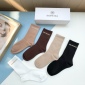 Replica Balenciaga's new gold bronzed midtube women's socks