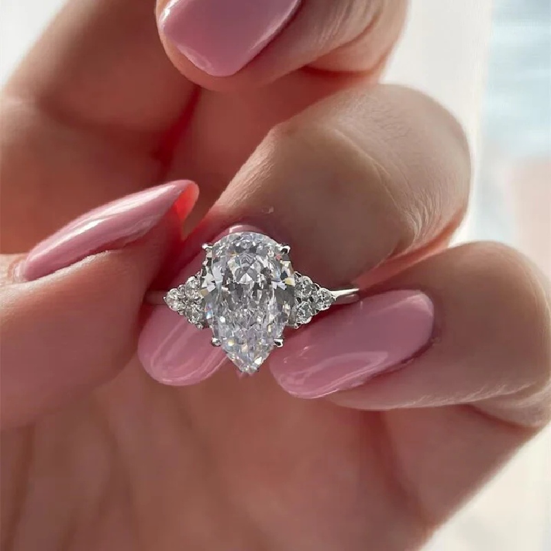 Pear Cut With Side Round Diamond Engagement Ring Moissanite