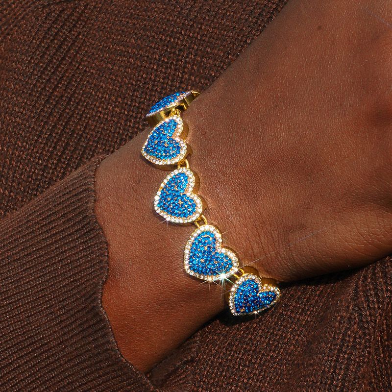 15mm 8 Clustered Sapphire Heart Link Bracelet In Gold With Gold Shine