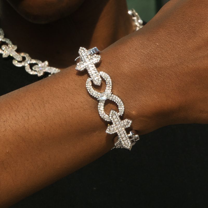 Street Luxury Baguette Cut Cross With Infinity Link Bracelet In White Gold