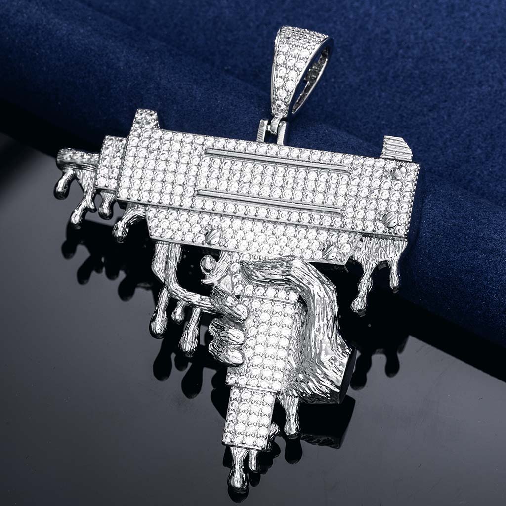 Hand Holding Dripping Gun Pendant In White Gold With Street Luxury Shine - Image 3