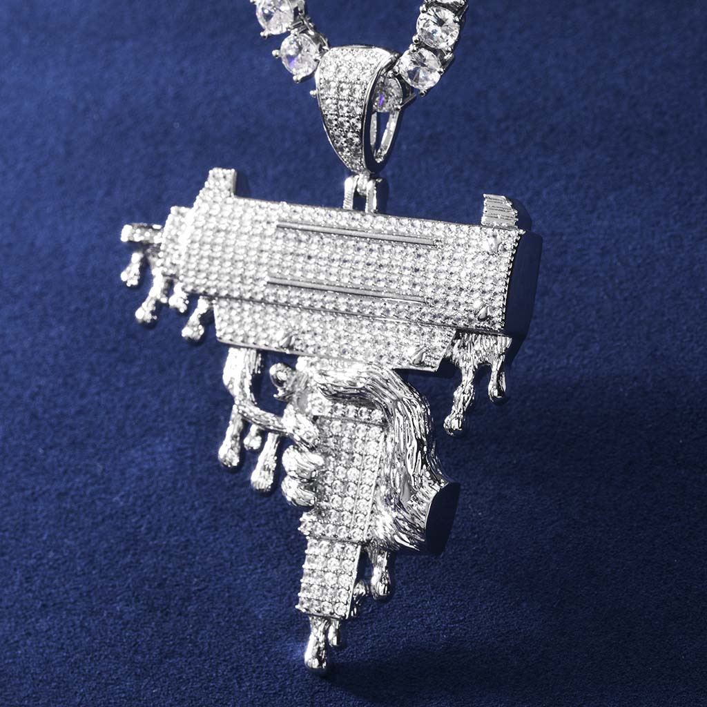 Hand Holding Dripping Gun Pendant In White Gold With Street Luxury Shine - Image 4