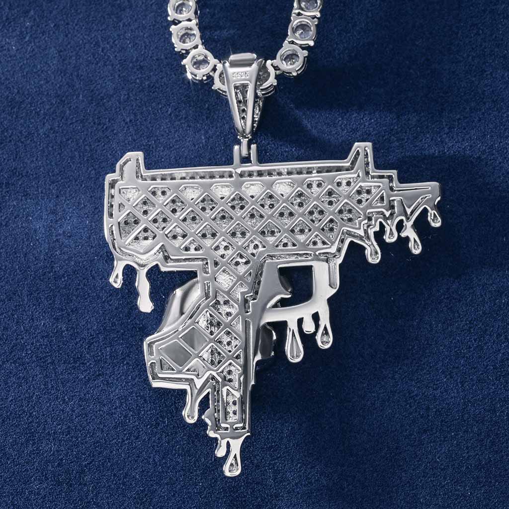 Hand Holding Dripping Gun Pendant In White Gold With Street Luxury Shine - Image 5